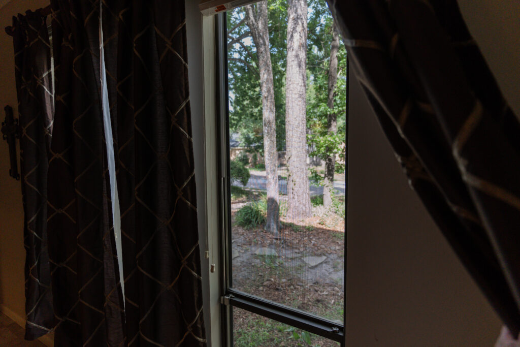 Interior view of a residential window before professional window cleaning in Houston, TX.