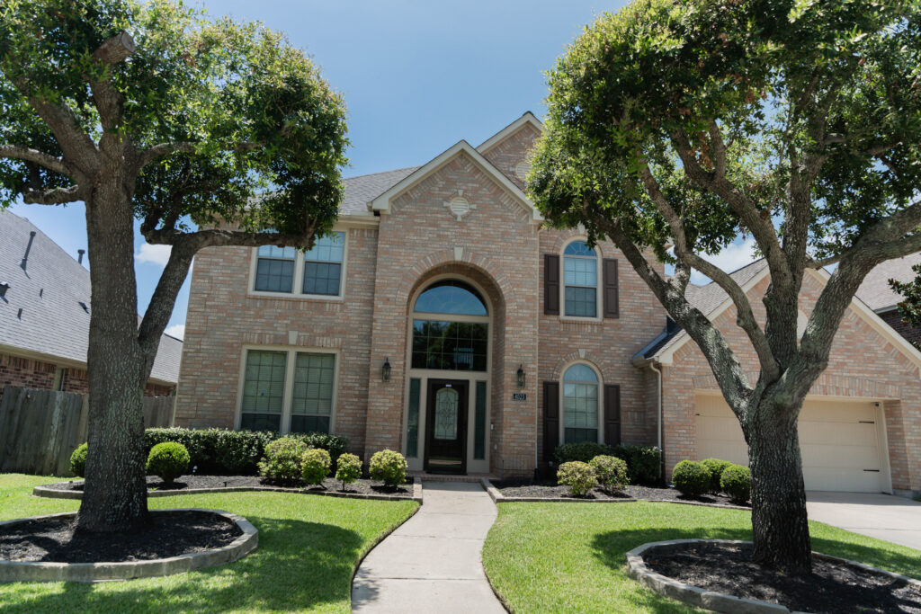 Front exterior of a residential home before professional window cleaning service in Houston, TX.